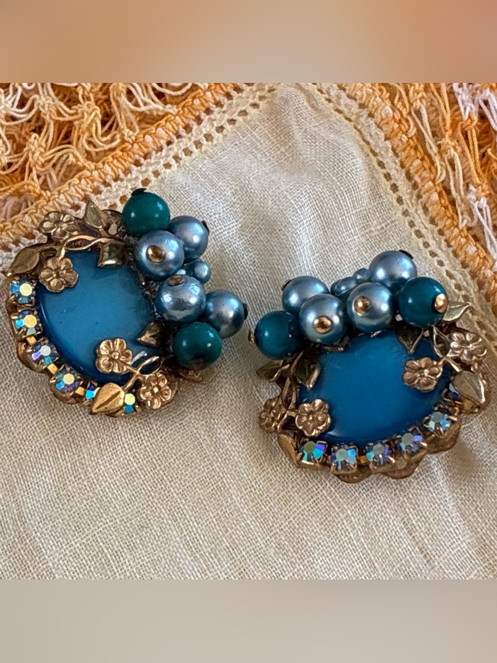 Artisan clip earrings created with vintage components in Aqua